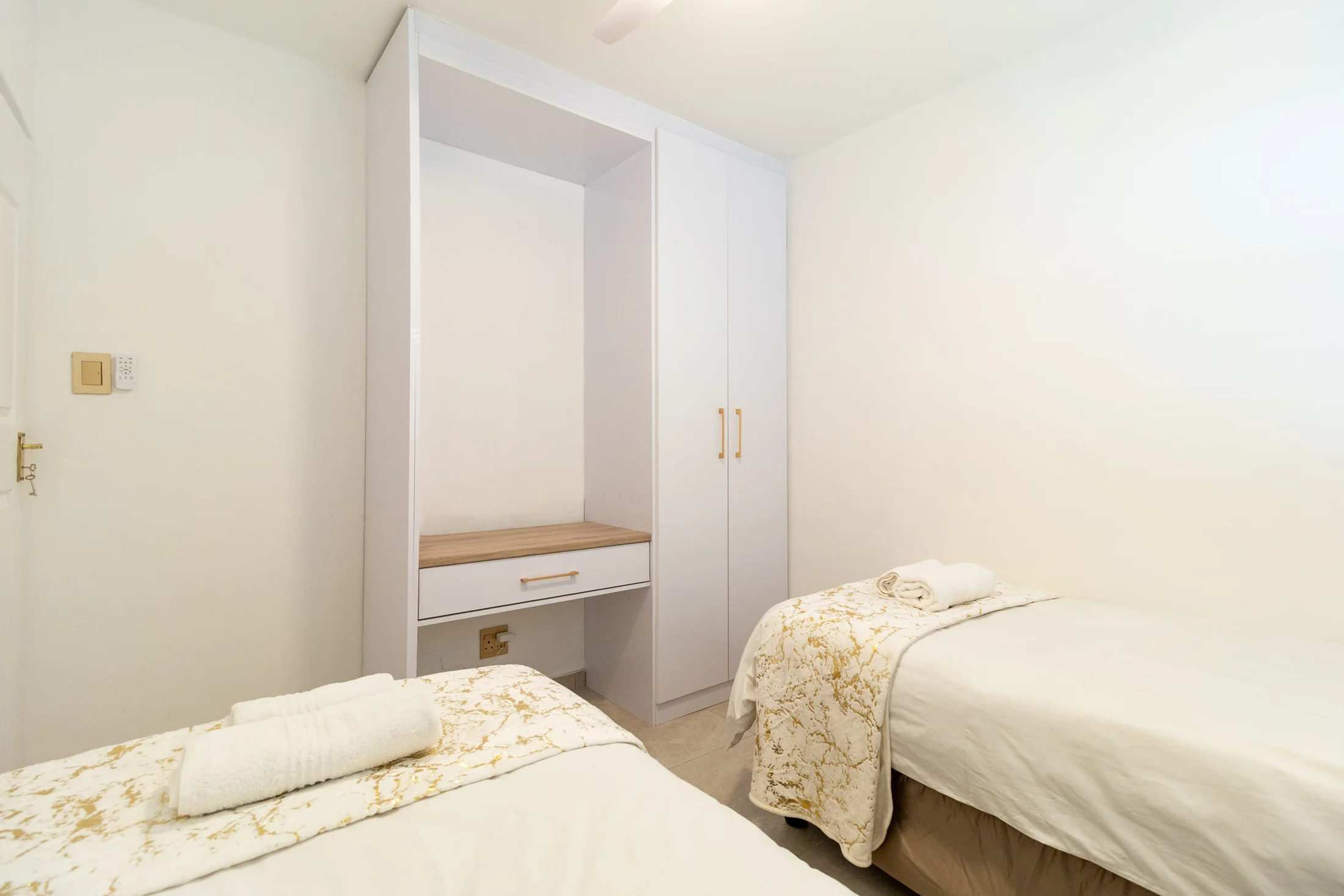 Twin bedroom storage and dressing area